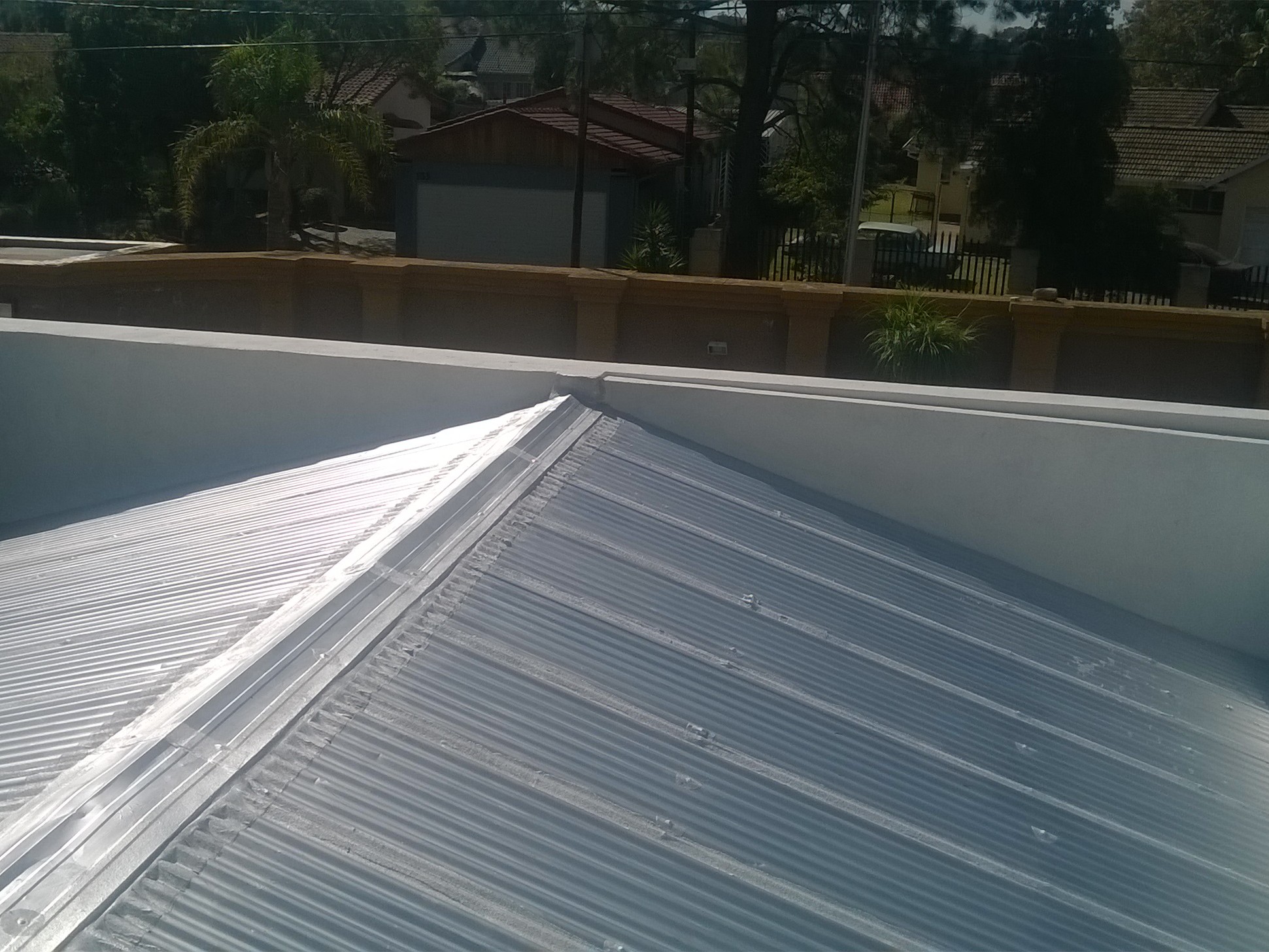 Metal roof waterproofing and sealing on a residential property in Alberton