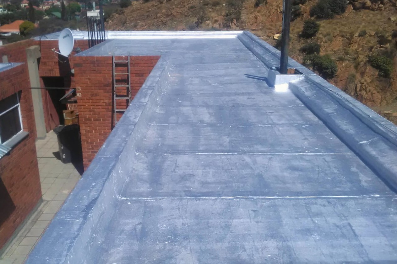 Completed torch-on re-waterproofing system on a flat roof